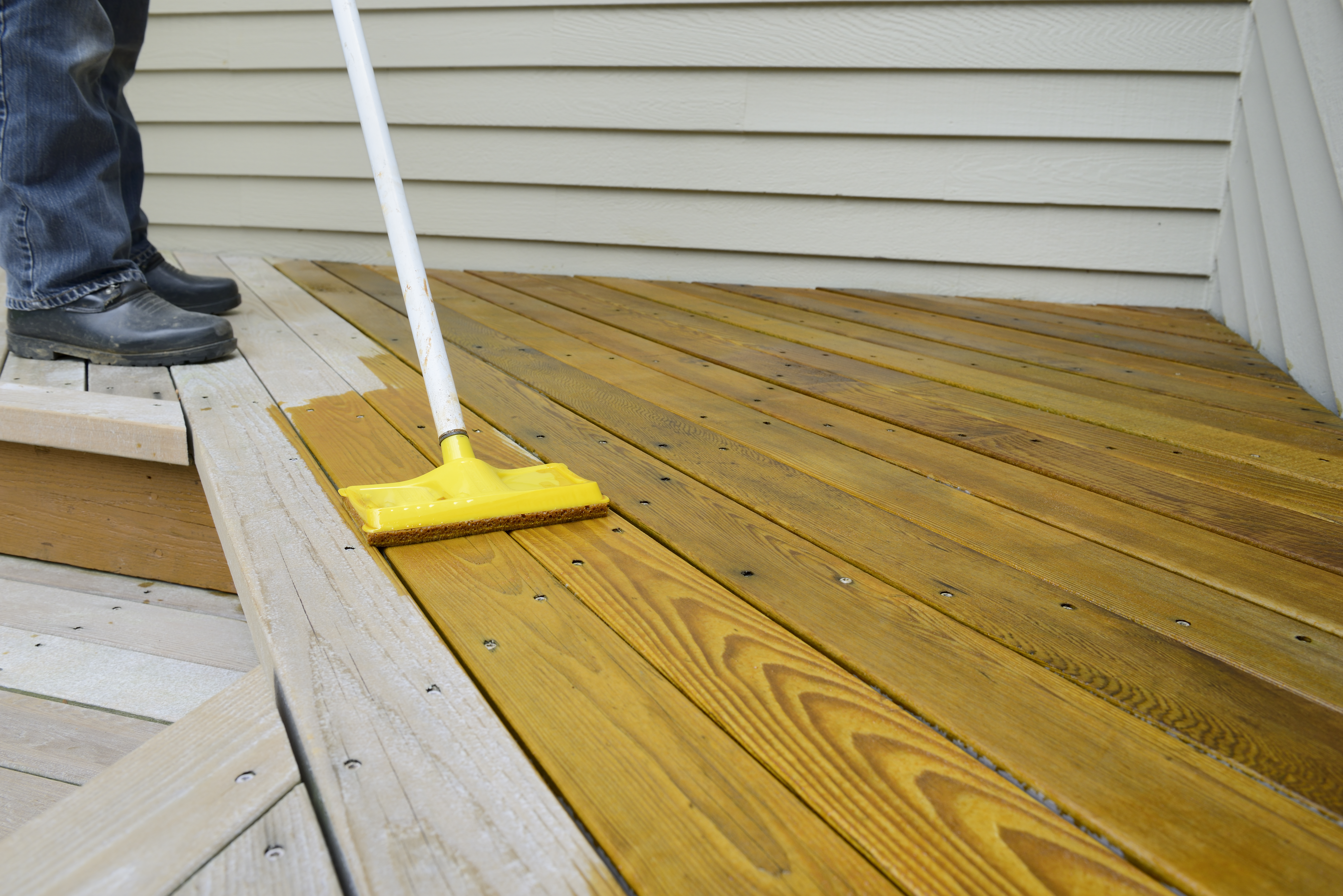 A deck pad can be used to make staining easier